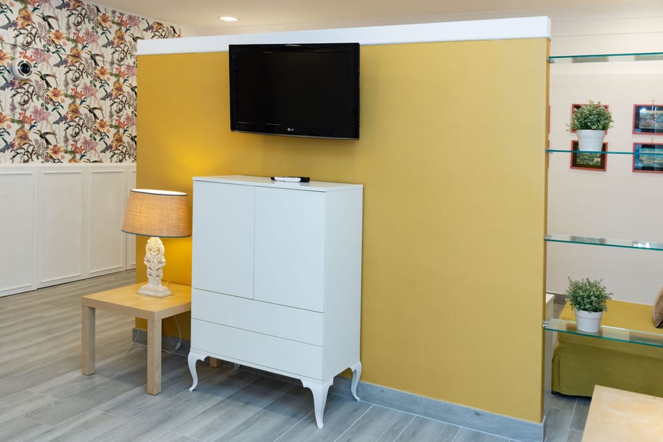 Comfort Studio, Multiple Beds | Living area | 20-inch LCD TV with satellite channels, TV, pay movies