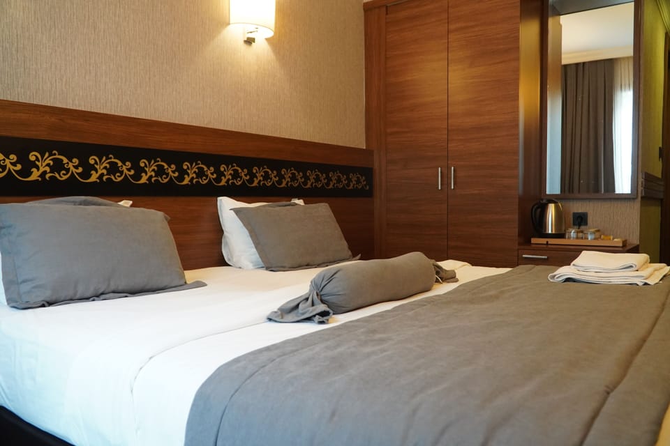 Single Room | Premium bedding, minibar, in-room safe, blackout drapes