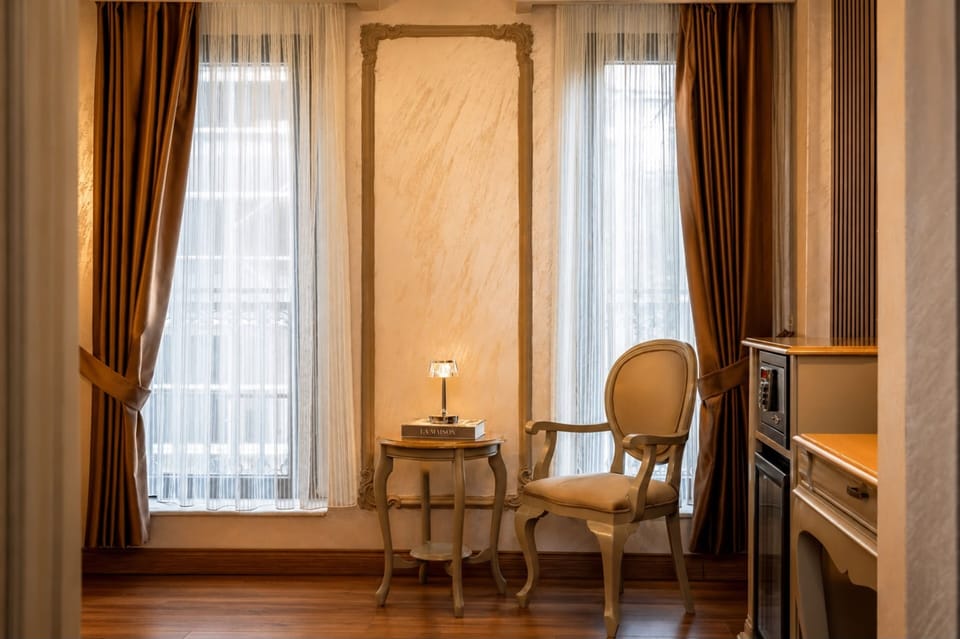 Deluxe Double or Twin Room | Living area | LCD TV