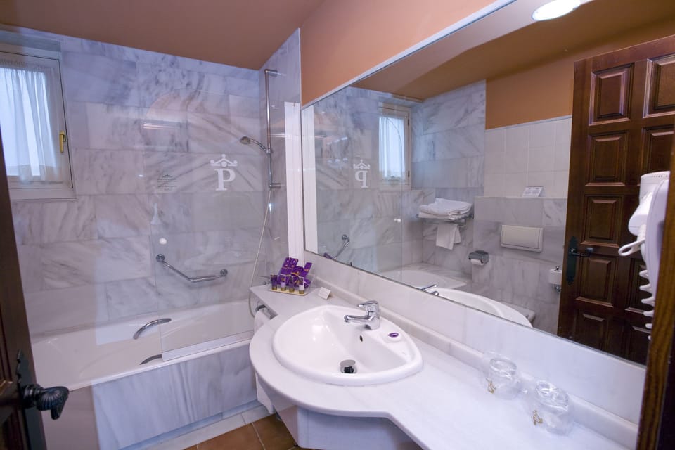 Eco-friendly toiletries, hair dryer, bidet, towels