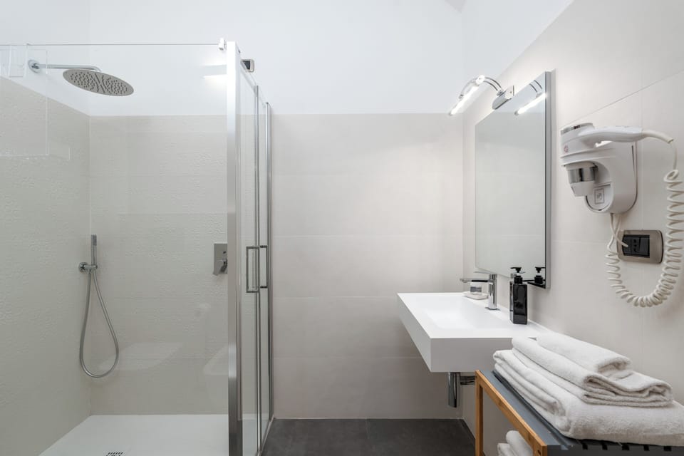 Triple Room | Minibar, in-room safe, desk, soundproofing