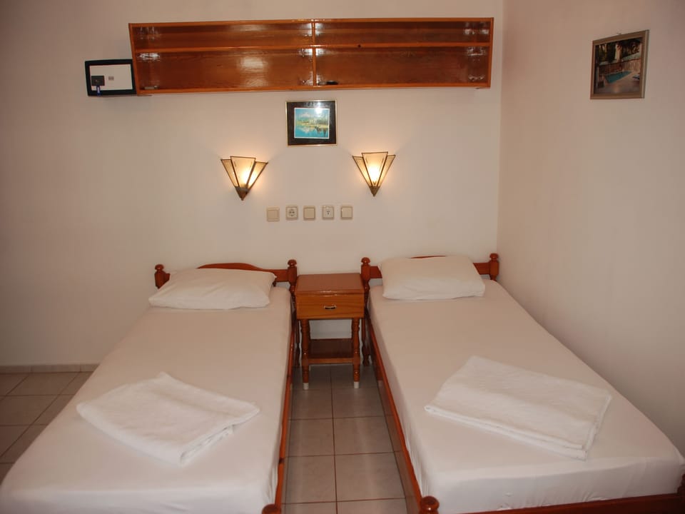 Standard Double Room | Pillowtop beds, in-room safe, iron/ironing board (on request)