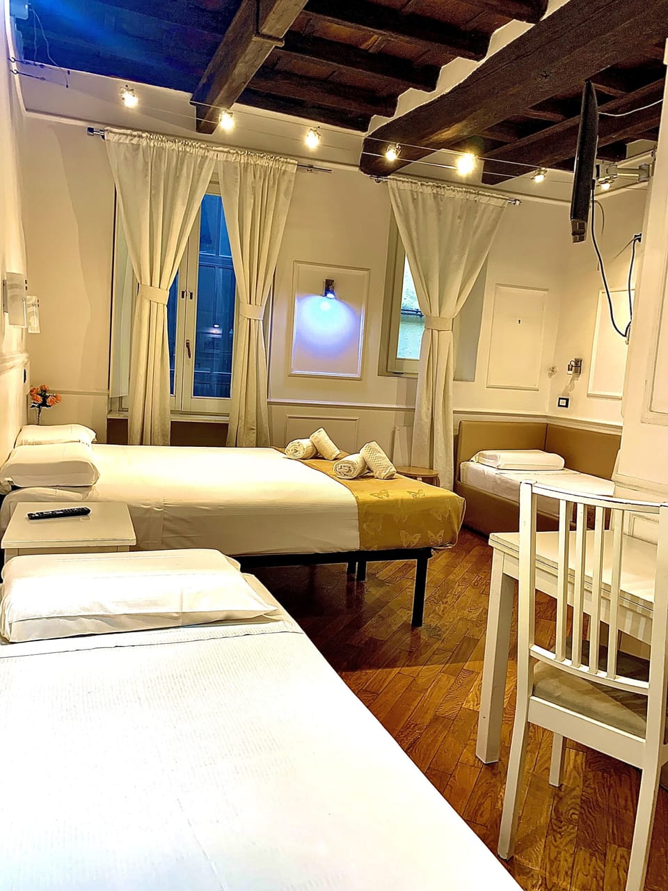 Quadruple Room | Minibar, in-room safe, desk, iron/ironing board