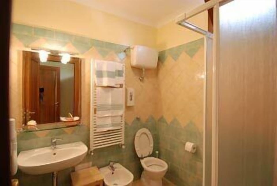 Shower, eco-friendly toiletries, hair dryer, bidet