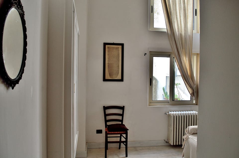 Family room | Frette Italian sheets, down comforters, Select Comfort beds