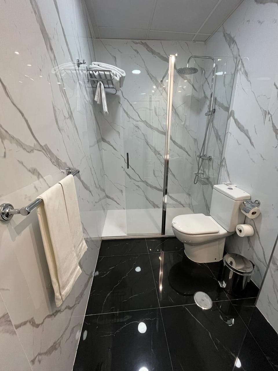 Shower, designer toiletries, hair dryer, bathrobes