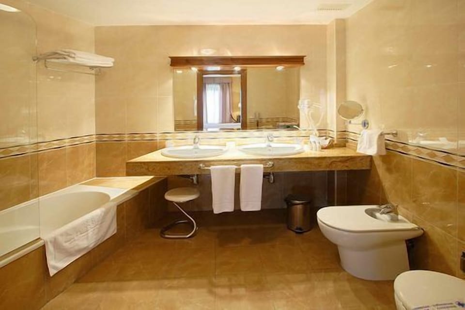 Superior Room | Bathroom | Hair dryer, towels, soap, shampoo