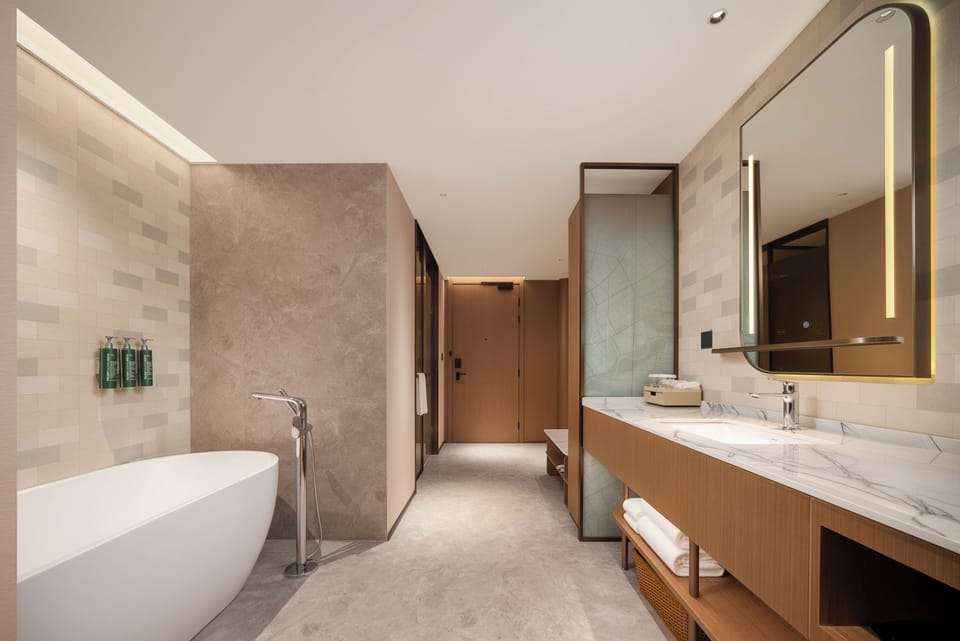 Deluxe Suite, 1 King Bed | Bathroom | Hair dryer (on request)