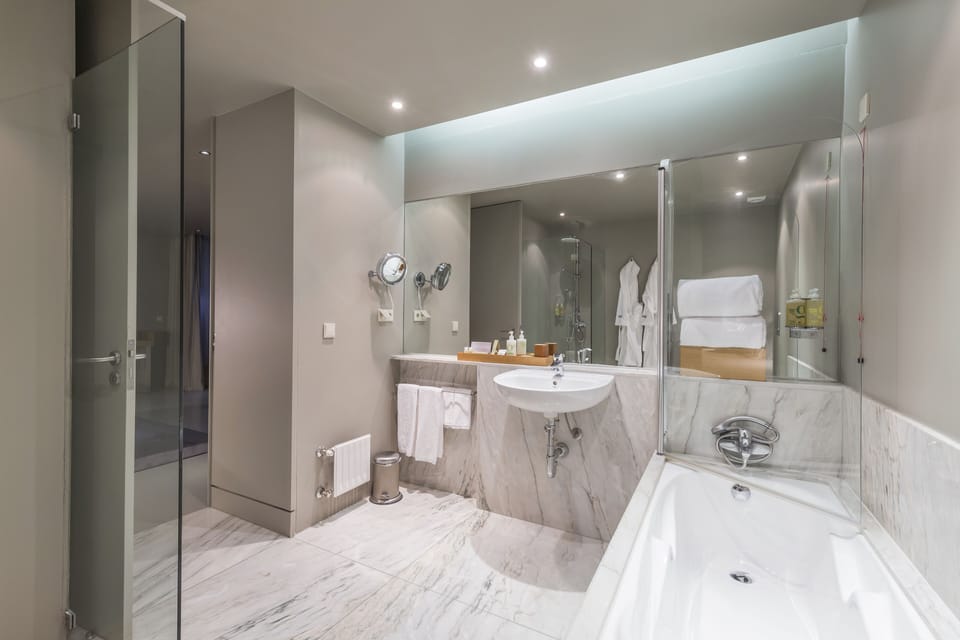 Suite | Bathroom | Bathtub, hair dryer, bathrobes, bidet