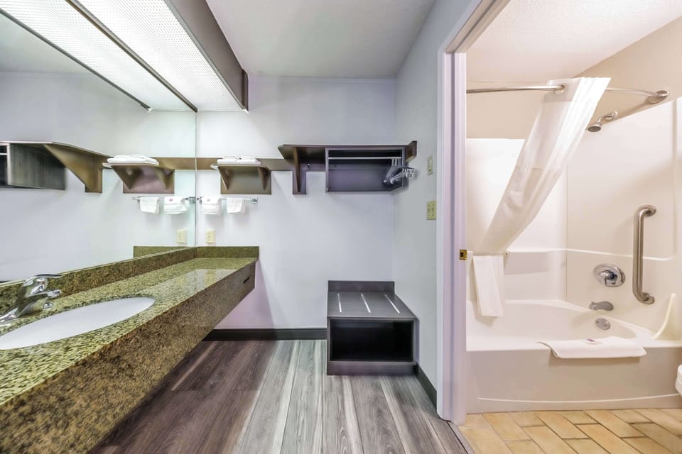 Standard Room, 2 Queen Beds, Non Smoking | Bathroom | Combined shower/tub, hair dryer, towels