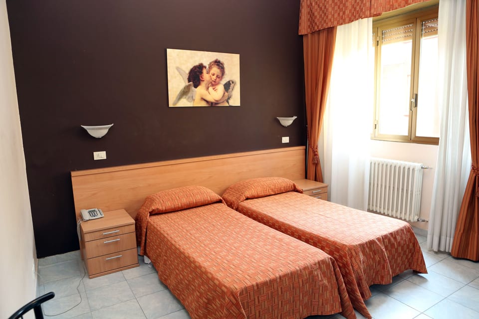 Double or Twin Room | Down comforters, Select Comfort beds, desk, blackout drapes