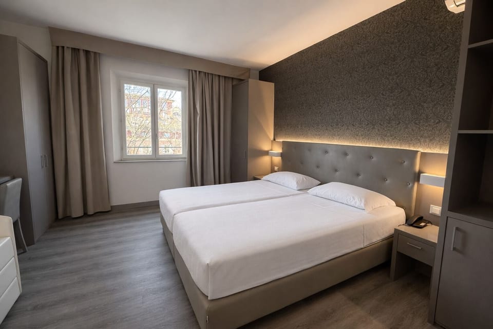 Superior Quadruple Room | Minibar, in-room safe, desk, blackout drapes