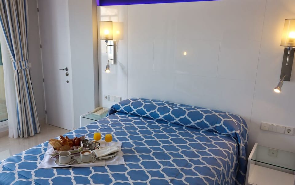 Double or Twin Room, Partial Sea View | 1 bedroom, minibar, desk, blackout drapes