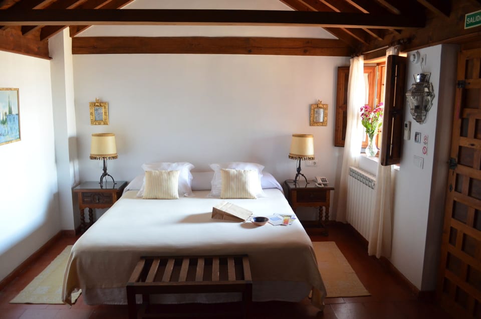 Egyptian cotton sheets, down comforters, Select Comfort beds, minibar