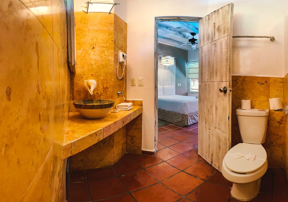 Standard Room, Garden View | Bathroom | Shower, rainfall showerhead, towels, soap