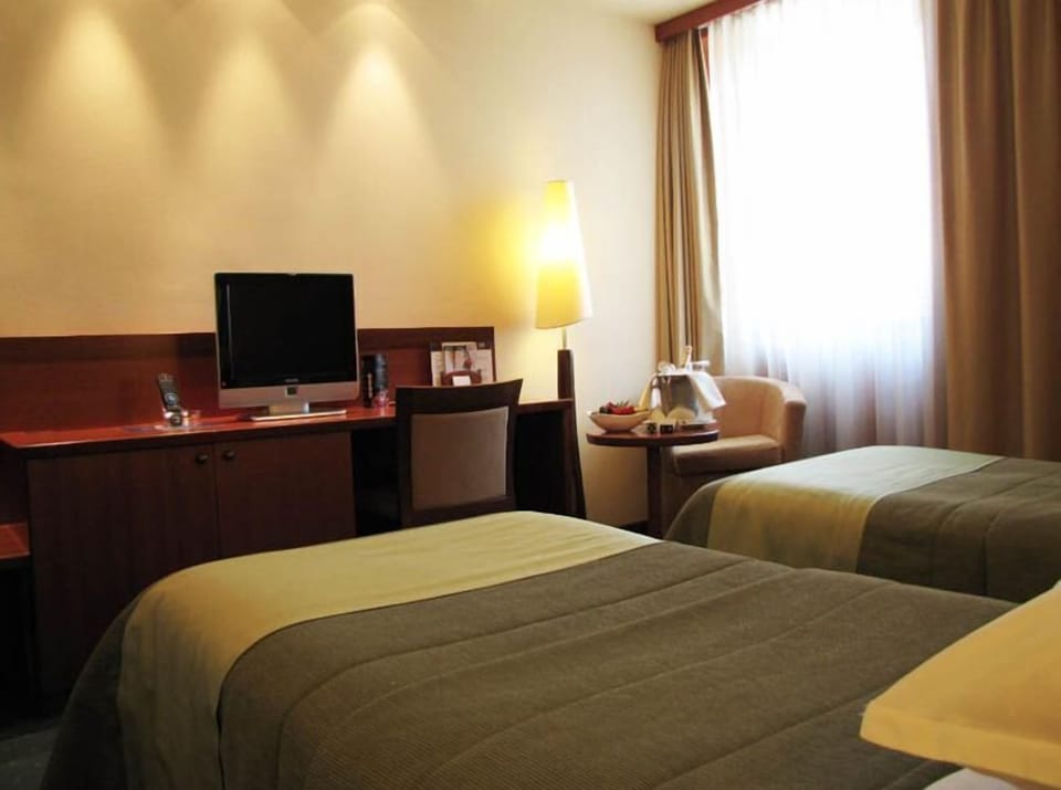 Classic Double or Twin Room, 1 Double or 2 Twin Beds | Minibar, in-room safe, desk, blackout drapes