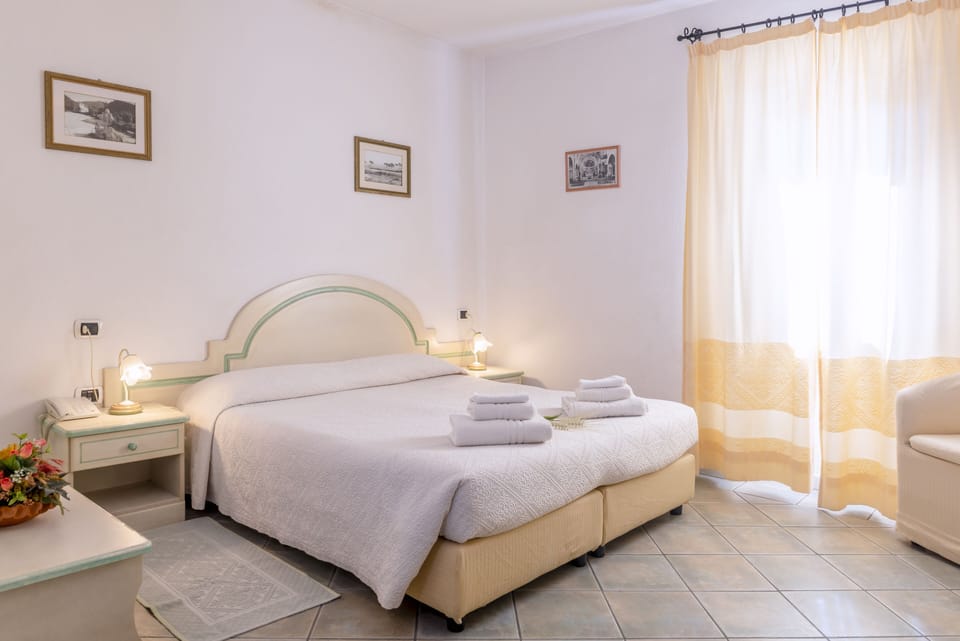 Double or Twin Room | Minibar, desk, blackout drapes, free WiFi