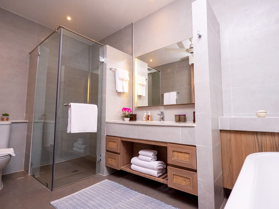 Sanctuary Deluxe | Bathroom | Separate tub and shower, hair dryer, bathrobes, slippers