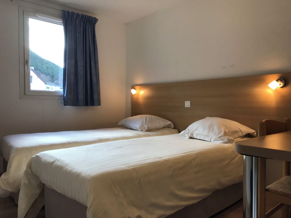 Twin Room | Memory foam beds, individually furnished, desk, soundproofing