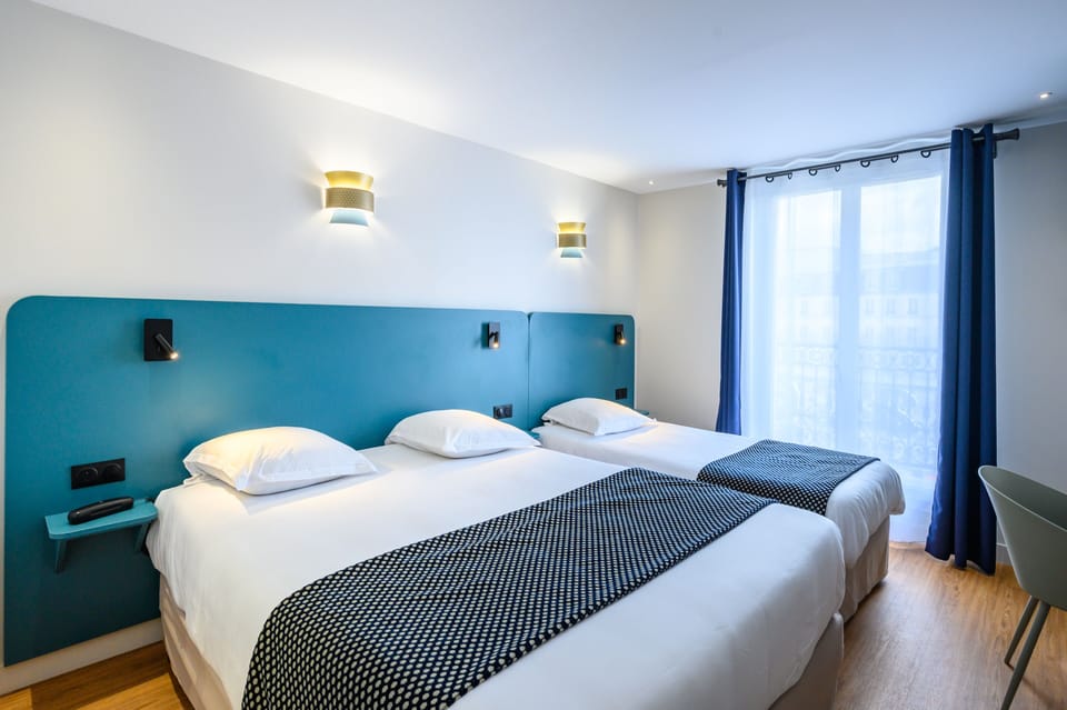Triple Room | Frette Italian sheets, premium bedding, Select Comfort beds