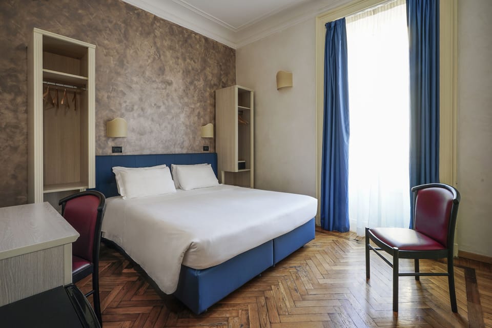 Double Room | Down comforters, minibar, in-room safe, individually decorated