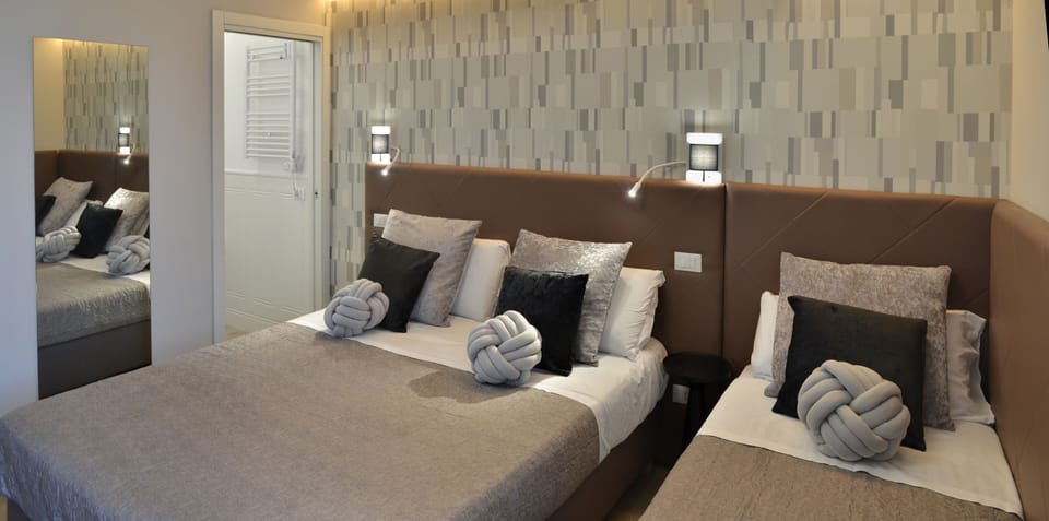 Triple Room | Select Comfort beds, in-room safe, desk, blackout drapes