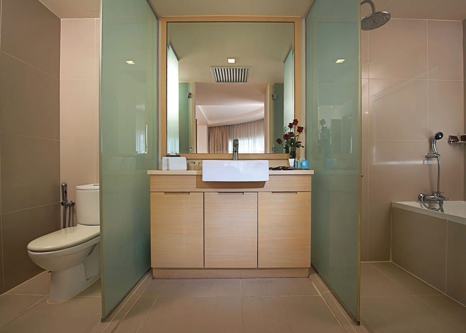 Suite, 1 King Bed | Bathroom | Shower, hair dryer, slippers, bidet