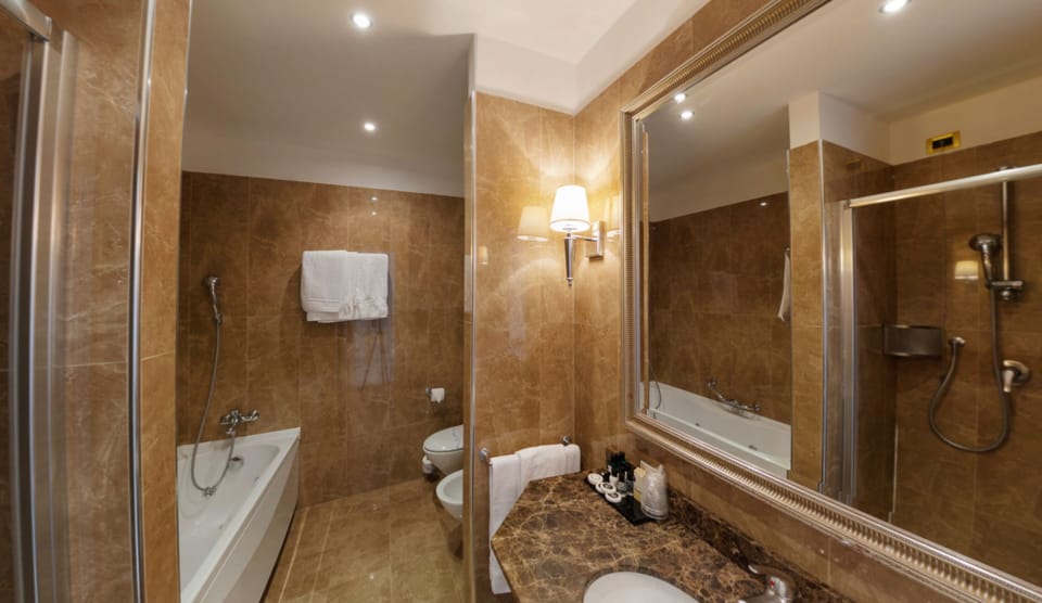 Junior Suite, 1 Bedroom, Sea View (beach access included) | Bathroom | Hair dryer, slippers, bidet, towels