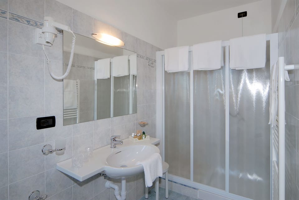 Shower, free toiletries, hair dryer, slippers