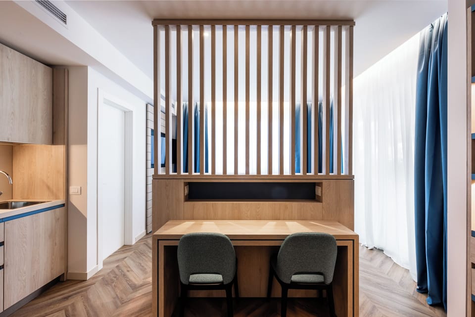 Comfort Studio, 1 Queen Bed, Kitchenette | In-room safe, desk, blackout drapes, iron/ironing board