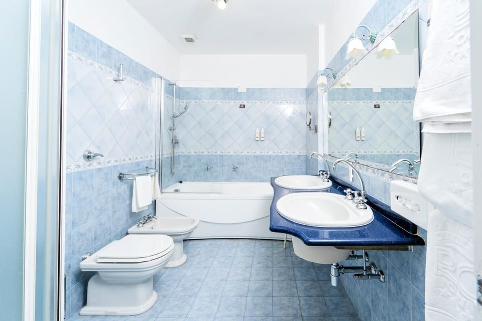 Combined shower/tub, free toiletries, hair dryer, slippers