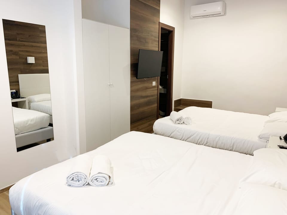 Quadruple Room | Premium bedding, in-room safe, cribs (free), WiFi (free)