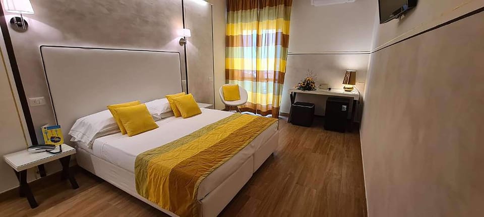 Standard Room, 1 Queen Bed, Balcony, Partial Sea View | Minibar, in-room safe, desk, laptop workspace