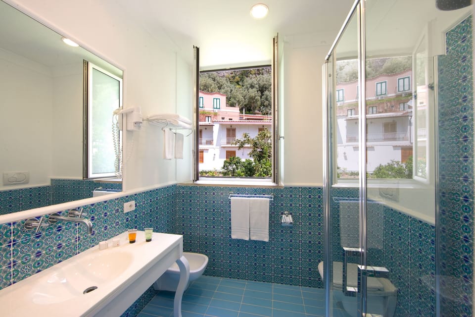 Standard Room | Bathroom | Free toiletries, hair dryer, towels