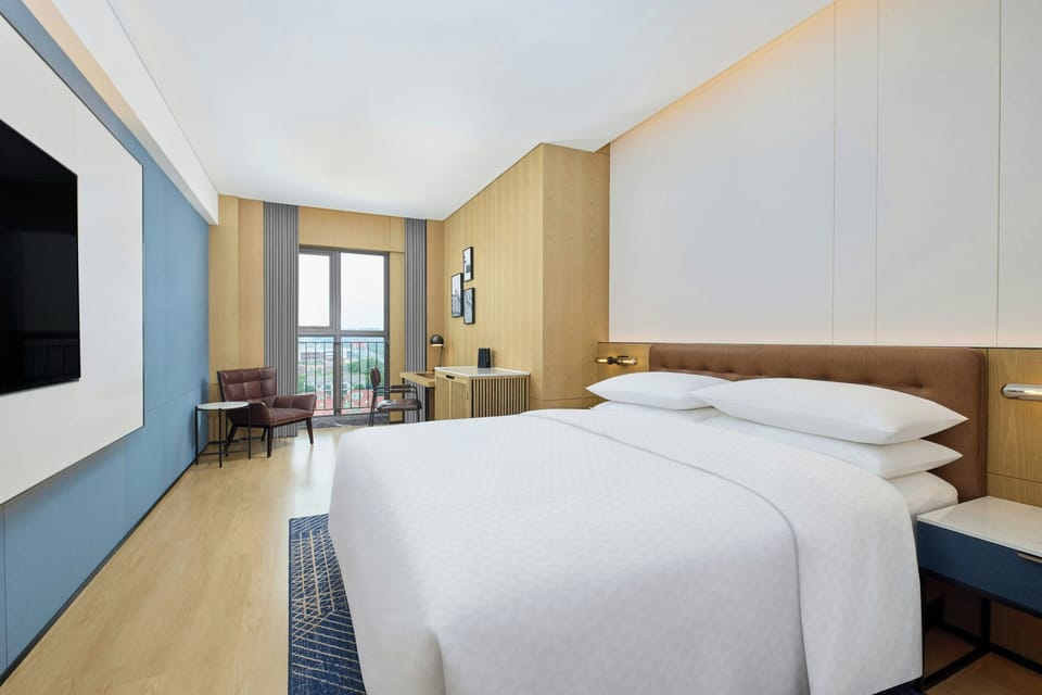 Standard Room, 1 King Bed, City View | Minibar, desk, blackout drapes, iron/ironing board