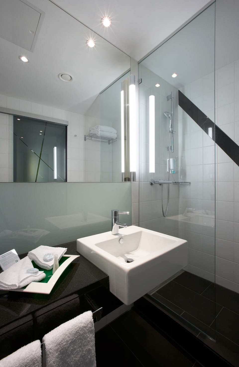 Combined shower/tub, free toiletries, hair dryer, slippers
