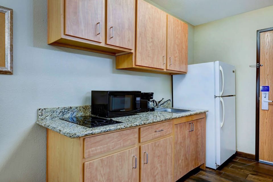 Desk, laptop workspace, blackout drapes, iron/ironing board