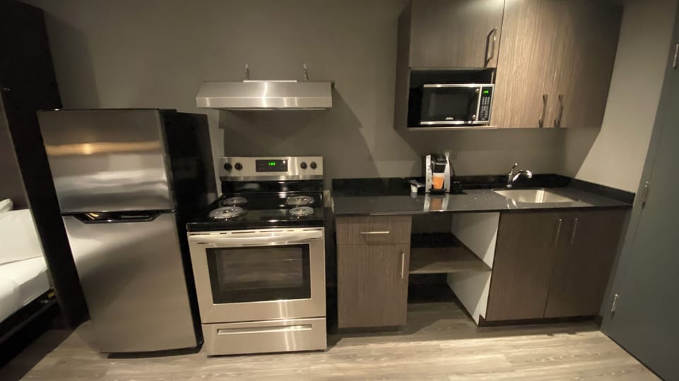 Family Studio Suite | Private kitchen | Coffee/tea maker, fridge, microwave (on request), electric kettle