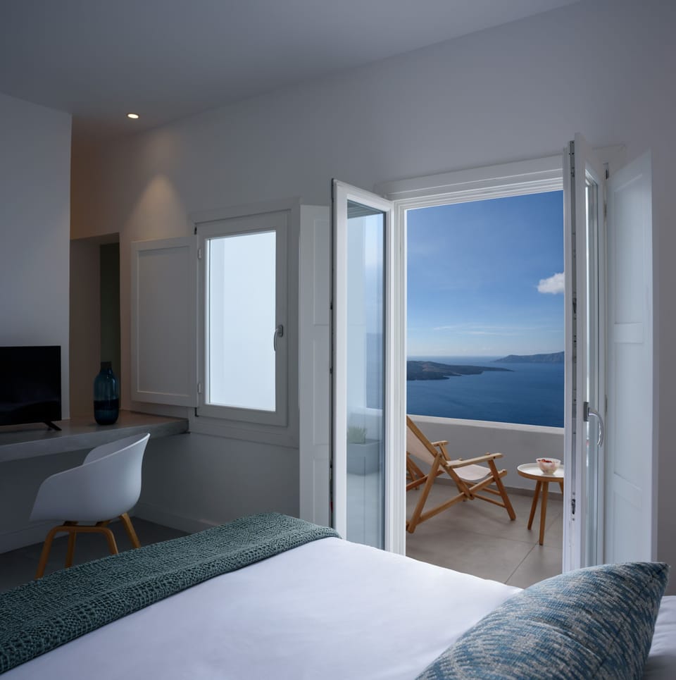 Suite, Balcony (Caldera View) | Premium bedding, minibar, in-room safe, individually decorated