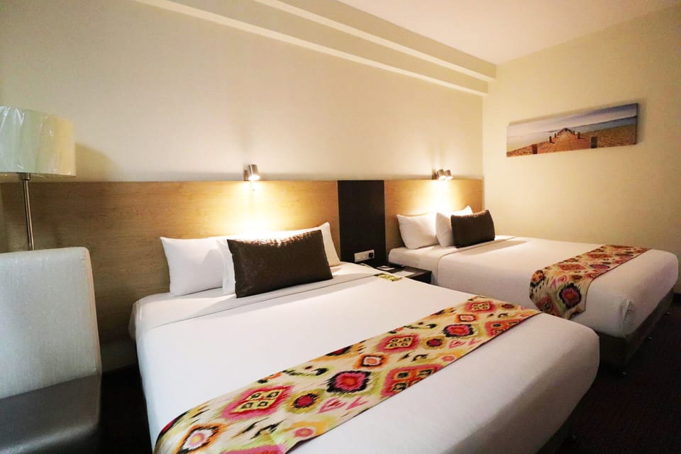 Premium Quadruple Room | Minibar, in-room safe, desk, laptop workspace
