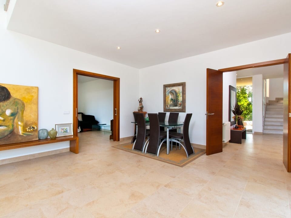 Large dining room inside the house with chairs for 6.