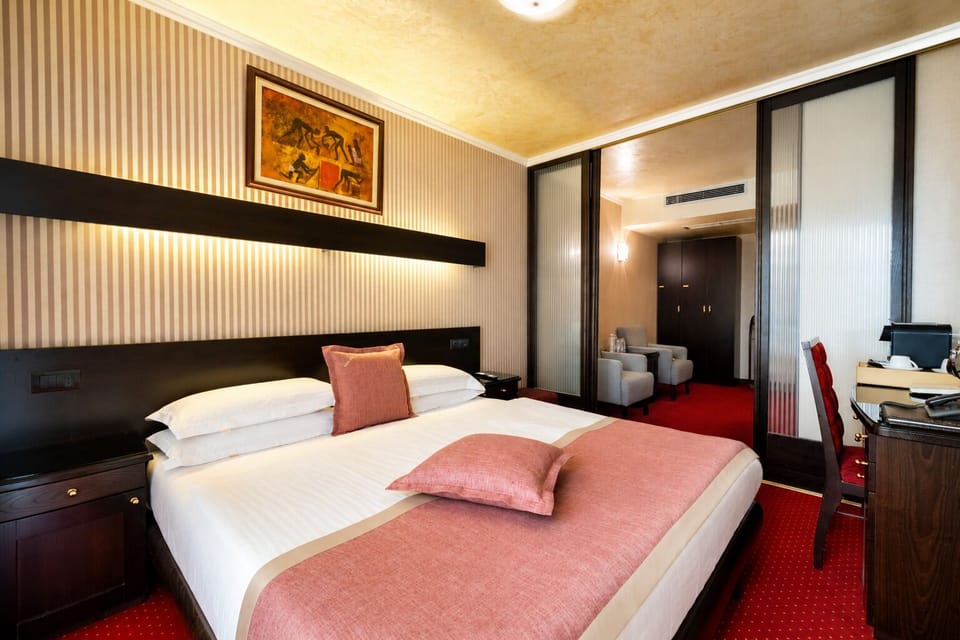 Deluxe Room | Premium bedding, in-room safe, desk, blackout drapes