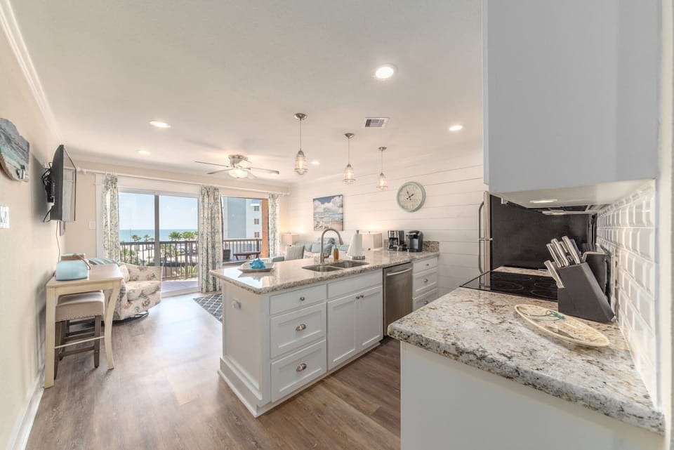 Kitchen open to living room giving the condo that extra roomy feeling.