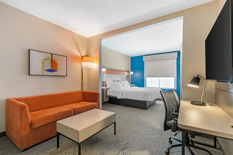 Studio Suite, 1 King Bed, Microwave (Minifridge) | Living area | Flat-screen TV