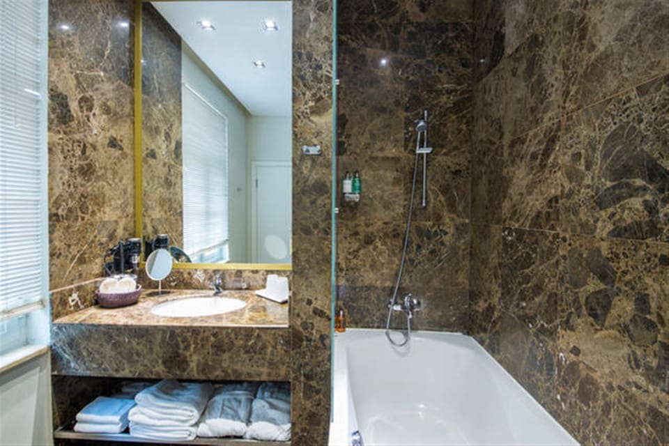 Designer toiletries, hair dryer, bathrobes, slippers