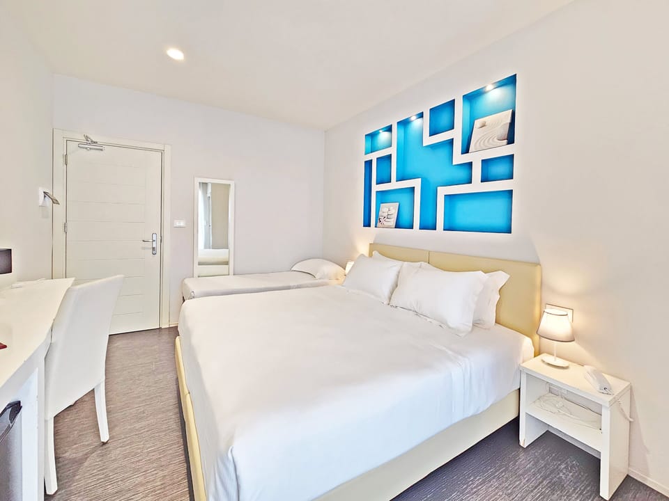 Triple Room, Balcony, Sea View | In-room safe, desk, WiFi (free), bed sheets