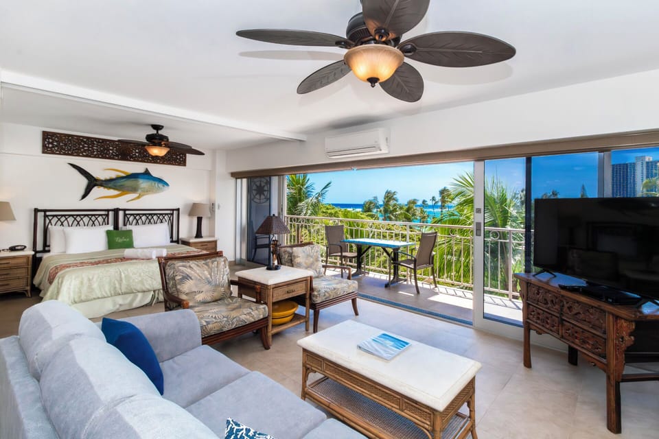 View of living room area looking out over the lanai and ocean.