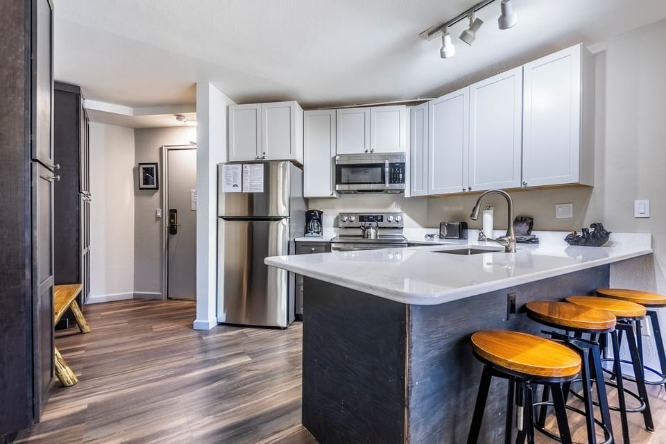 Newly updated kitchen with granite countertop and stainless stee