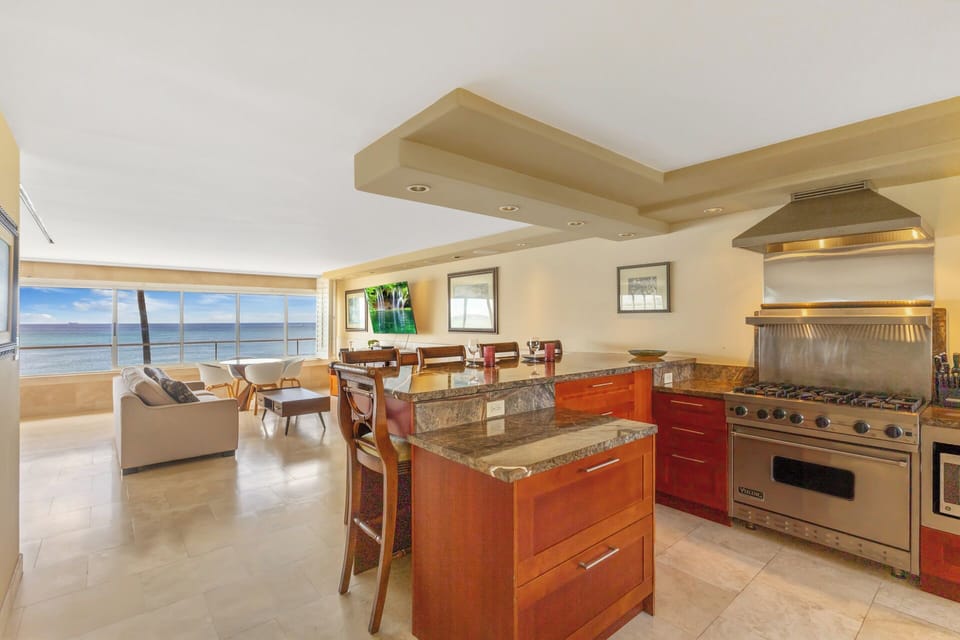 Kitchen - Full-sized chef's kitchen with ocean views to die for.  Window's both front and back allow for excellent cross breeze through the unit.