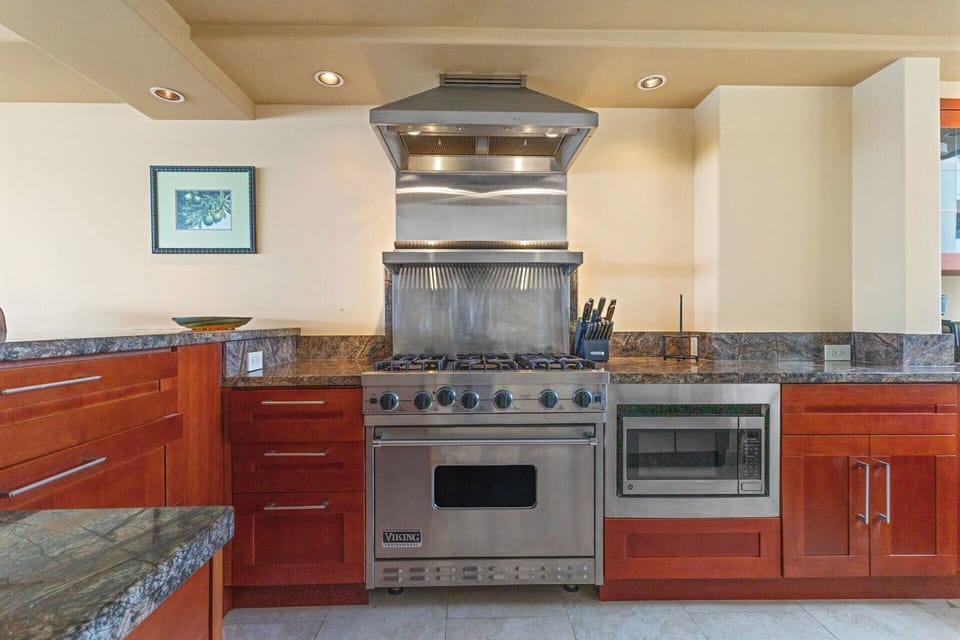 Kitchen - A chef's dream kitchen.  All stainless steel appliances with a wolf gas stove/oven combination.